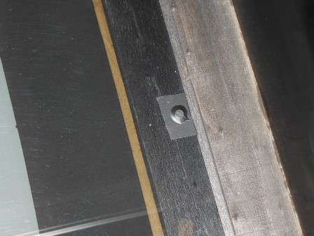 Smoked plexiglass screwed & covered