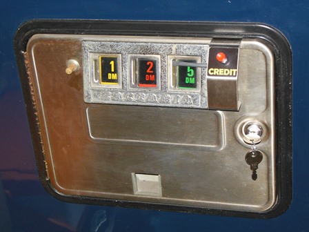 Coin door with credit button